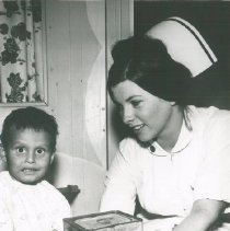 Mary Rich HOPE nurse with patient on SS HOPE in Colombia in 1967.