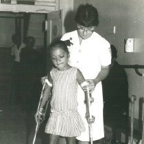 Carol Levin with physical therapy patient on SS HOPE in Colombia in 1967.