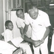Surgeon Vincent Zecchino with patient on SS HOPE in Colombia in 1967.