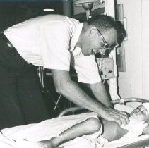 H Kirchdoerher with patient on SS HOPE in Colombia 1967.