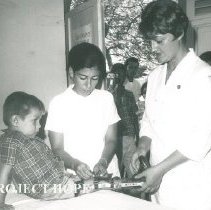 HOPE physical therapist with patient in clinic while SS HOPE in Colombia