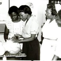 Barbados nurses practicing insertion of airway tubes with HOPE nurse.