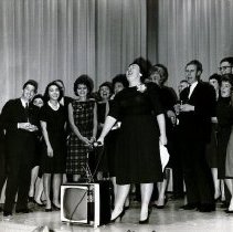 Project HOPE nurse Doris Edwards singing in Peru 1963 with other HOPies