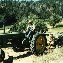 Tractor pulling hay bailer