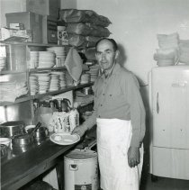 DeVere (Dud) Young in the kitchen at Dud's