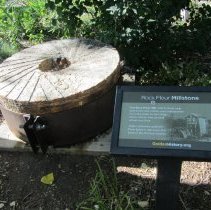 Rock Flour millstone with signage