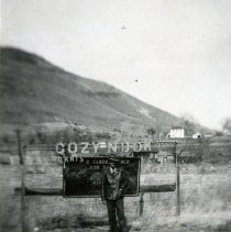 Keith Hinkley in front of Cozy Nook sign