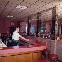 Gene Nix tends bar at the Holland House lounge