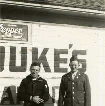 Military men posing in front of Duke's Place