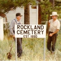 Muriel Ralston and Norman Ralston install Rockland Cemetery Sign