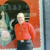 Richard "Jack" Wilhelm in front of Valentine's window at Carleen of Golden