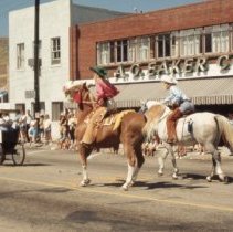 Buffalo Bill Parade riders in front of Eaker's Department Store