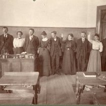 South School students standing at blackboard c. 1900