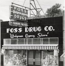 Foss Drug Store front with neon sign, taken c. 1940s