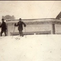 Skiers in front of Quaintance Block building