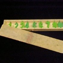 Box of Green Plastic Numbers