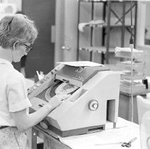 Woman Using a VariTyper Headliner