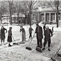 Sweeping the Ice on Bestor Plaza