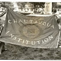 Miriam Sample Reading showing off Centennial Flag