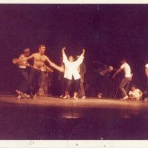 Actors Singing and Dancing on Stage