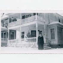 Clara Gibbs in front of Cottage