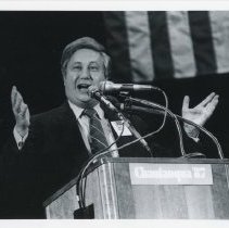 John Wallach Speaking at Podium