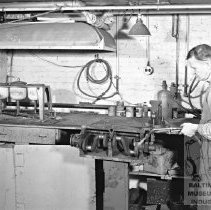 Man at work at R.J. Loock Co