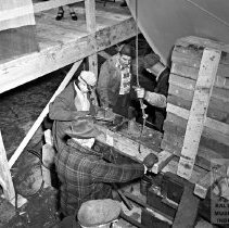 Workers under the bow