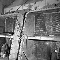 Workers erecting condenser