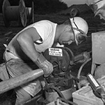 Wkr. operating machine on twr.