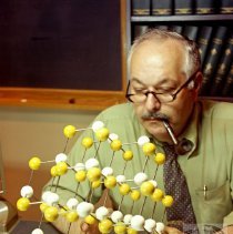 Scientist with molecule model