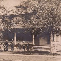 Maney family in front of home