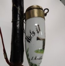 Pipe, left side of bowl