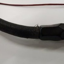 Detail, fraying and loss at plastic covering