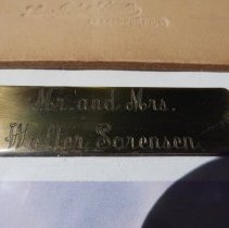 Front cover lower metal label