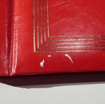 Front cover proper right lower corner foreign substance