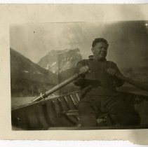 George Still DO, rowing a boat