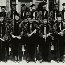 Twelve members of the KCOS Class of 1948 Jan in caps and gowns