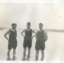 Three Men Swimming in lake