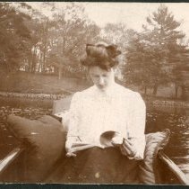 Woman Reading in Canoe