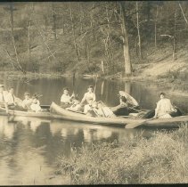 Group of People in Canoes