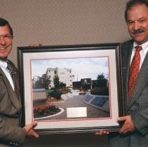 Steven Radjenovich Receiving Framed KCOM Portrait