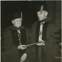 Dr. Harold Magoun presenting Dr. Clara Wernicke with certifacte 1947 Oct