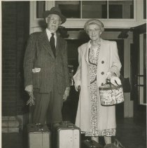Dr. & Mrs. Clarence Kerr with luggage