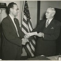 President Morris Thompson & Wallace Pearson shaking hands
