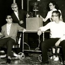 Students looking at machine during Sadie Hawkins 1956