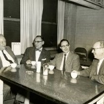 KCOS faculty drinking coffee and smoking cigarettes