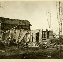 Family photo in front of destroyed house 1899 Apr