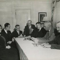 Large discussion banquet table during meeting