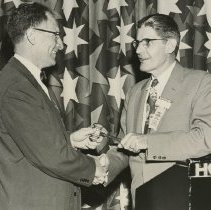 William A. Ellis turning over gavel to new AAO president 1955